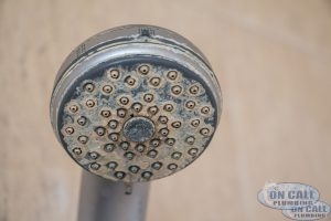 Calcium Build Up on Shower Head Caused by Hard Water
