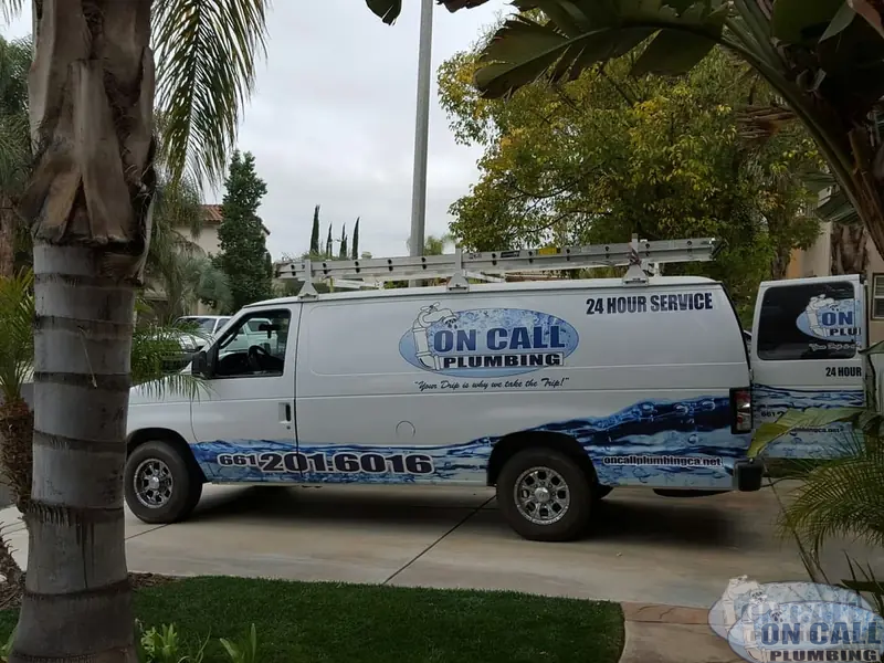 On Call Plumbing 24 hour service van parked outside a customer’s home