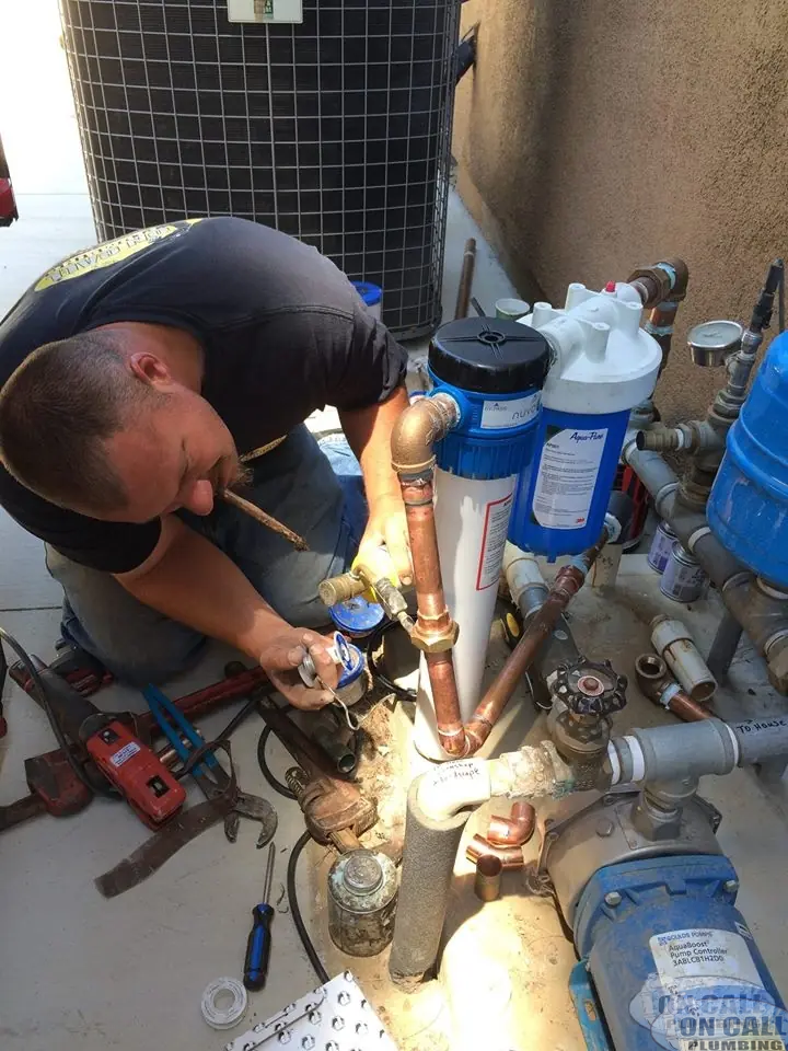 On Call plumber re-plumbing a water manifold