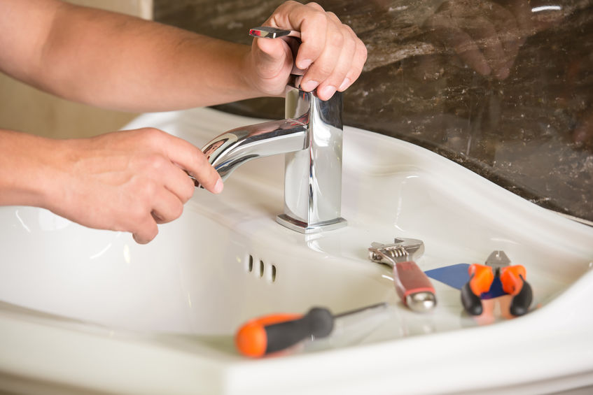 working on faucet repair